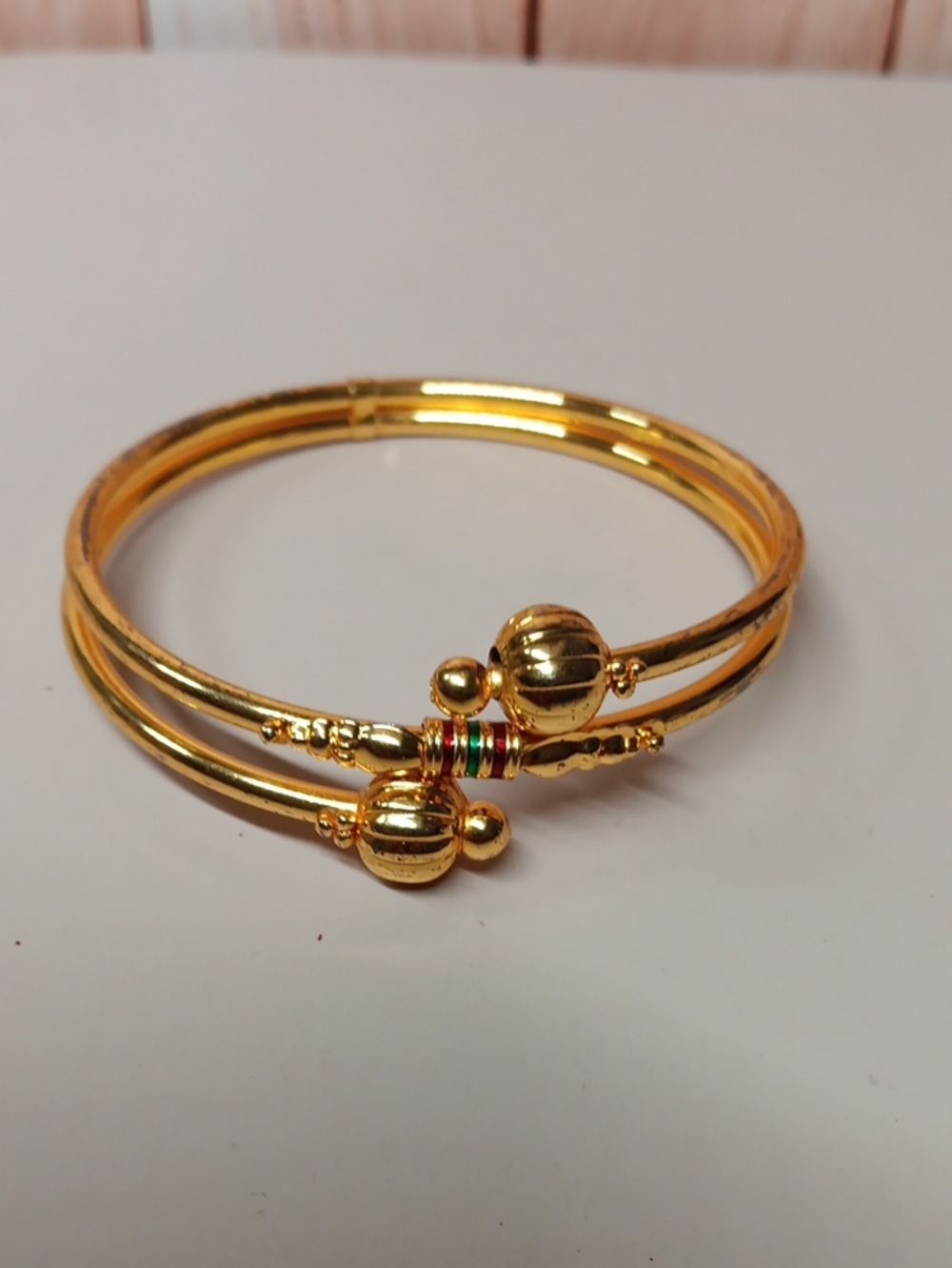 Gold-Tone Women’s Bangle Bracelet with Red and Green Accent Rings